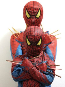 Spidey and Son show their wolverine pose while holding Pocky.
